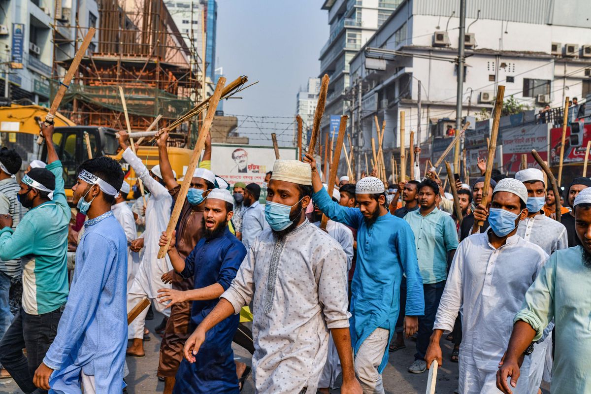 Hefazat-e Islam activists hold sticks while blocking the road during the demonstration. Hefazat-e Islam activists took part during a nationwide strike following the deadly clashes with police over Indian Prime Minister Narendra Modis visit in Dhaka, Bangladesh. 