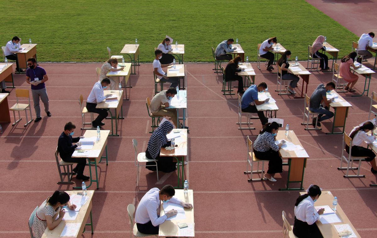 High school graduates take university entrance exams at a sports arena amid the pandemic in Tashkent, Uzbekistan.