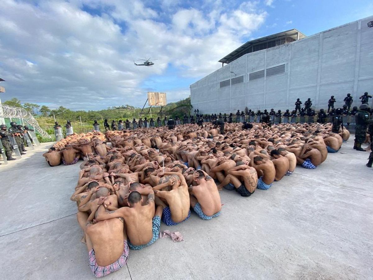 Honduran military police guard gang members after taking over control of prisons.