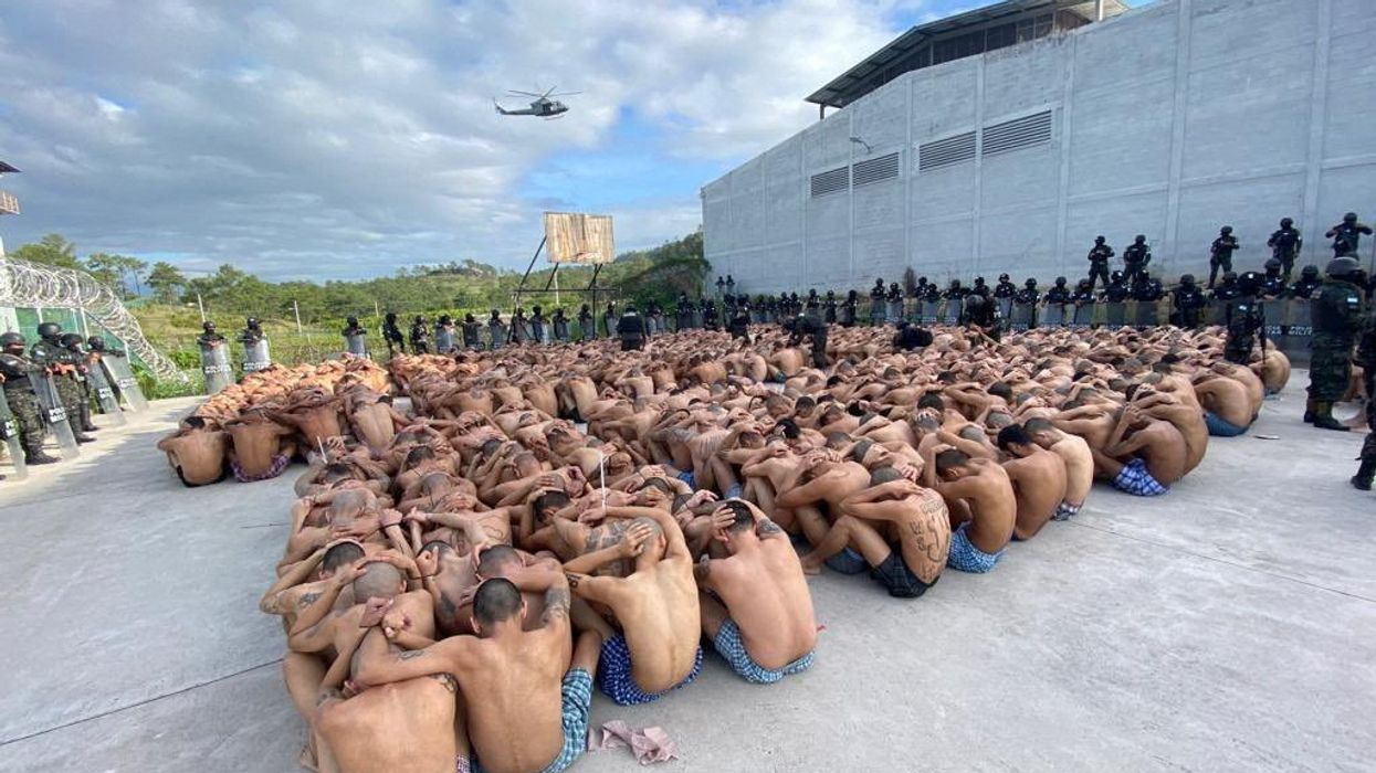 Honduran military police guard gang members after taking over control of prisons.