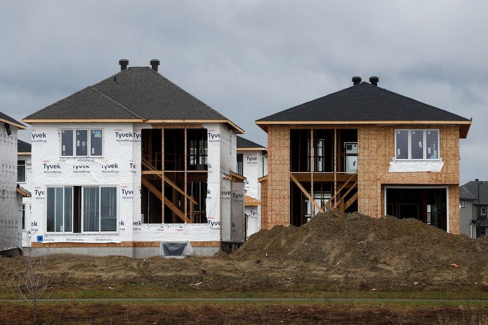 Houses are seen under construction in a neighbourhood of Ottawa, Ontario, Canada.