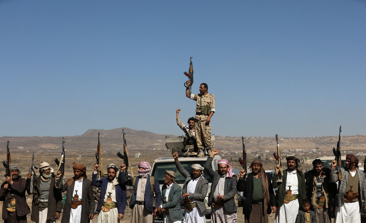 ​Houthi fighters and tribal supporters hold up their firearms during a protest against recent U.S.-led strikes on Houthi targets, near Sanaa, Yemen January 14, 2024.