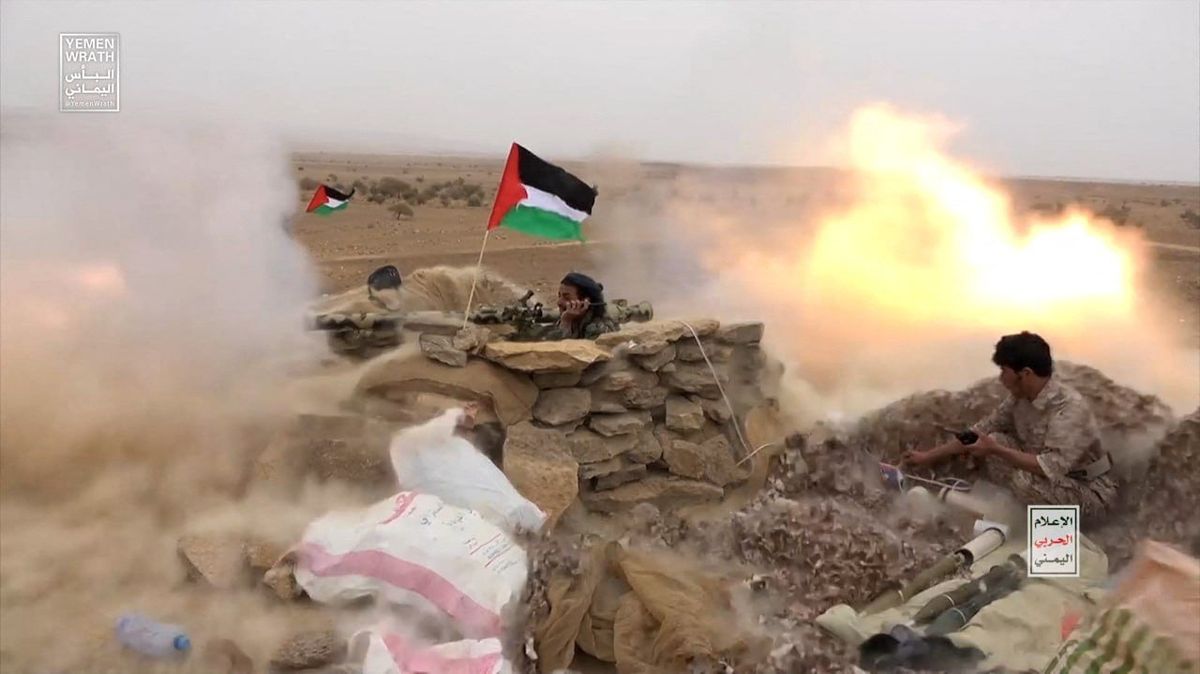 ​Houthi fighters fire anti-tank grenades during a military maneuver near Sanaa, Yemen, in late October. 
