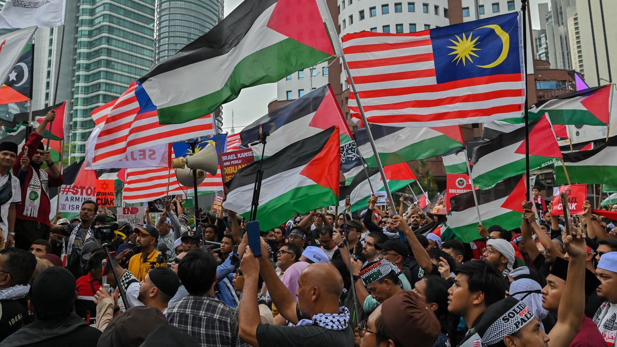 Hundreds of Muslim activists gather to protest in solidarity in the wake of the conflict between Israel and Hamas in the Gaza Strip outside the US embassy in Kuala Lumpur, Malaysia on October 20, 2023