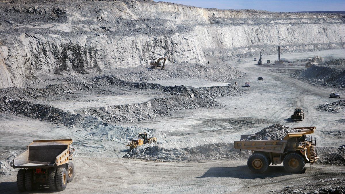 Hydraulic excavators scoop the broken rock into 100- or 150-tonne haul trucks at Agnico-Eagle's Meadowbank mine in Nunavut June 28, 2011.
