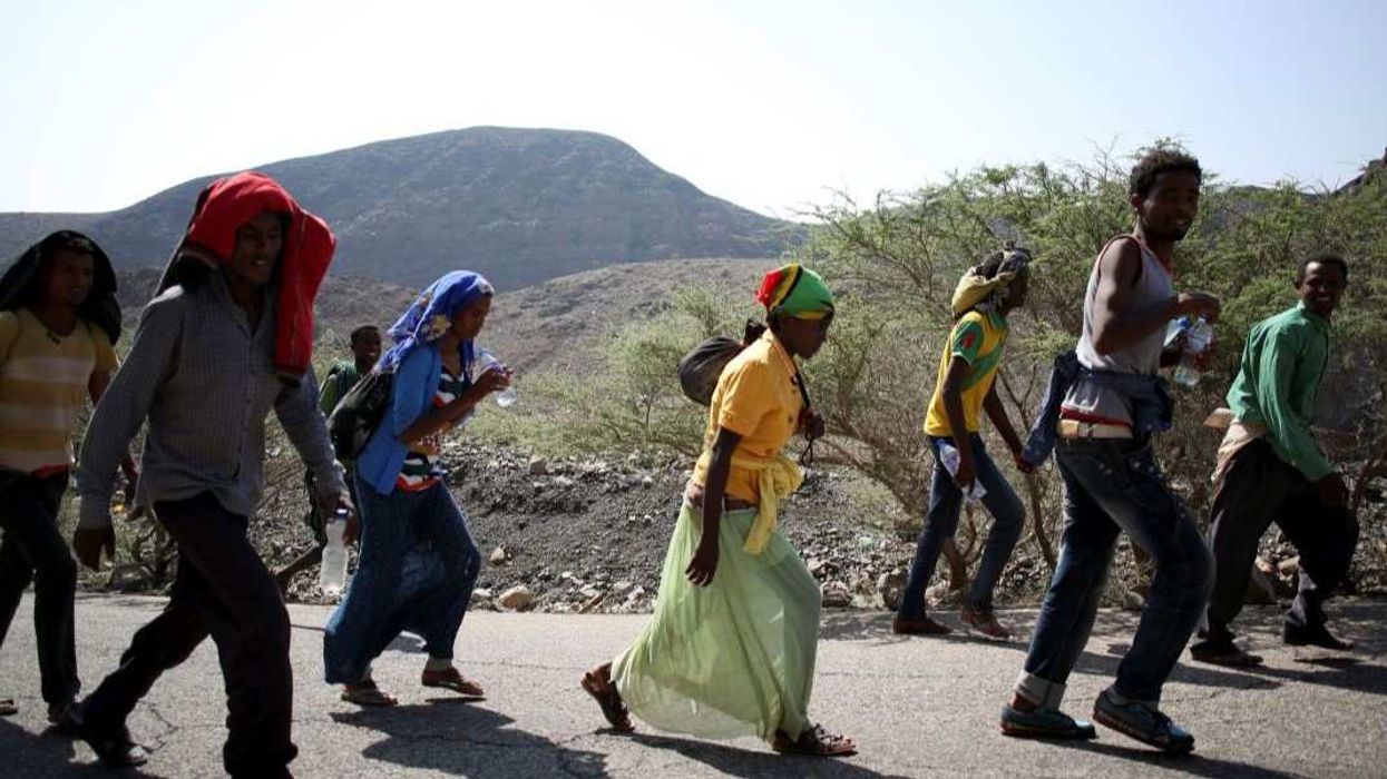Illegal immigrants from Ethiopia walk on a road near the town of Taojourah February 23, 2015. The area, described by the United Nations High Commissioner for Refugees (UNHCR) as one of the most inhospitable areas in the world, is on a transit route for thousands of immigrants every year from Ethiopia, Eritrea and Somalia travelling via Yemen to Saudi Arabia in hope of work. Picture taken February 23.