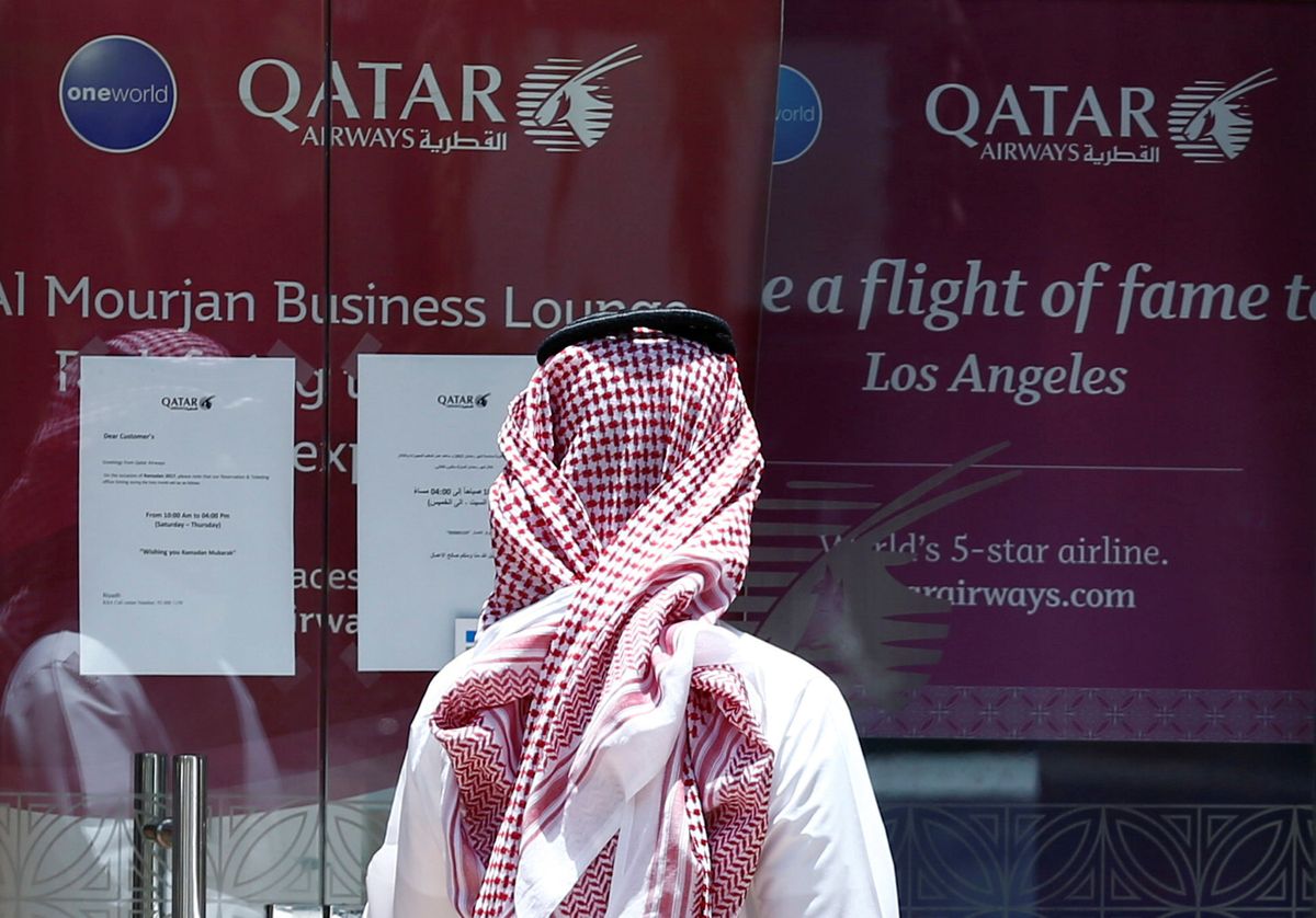 Hard Numbers: Qatar Airways sues, Twitter shuts down QAnon, Rohingyas spared the cane, global development aid falls