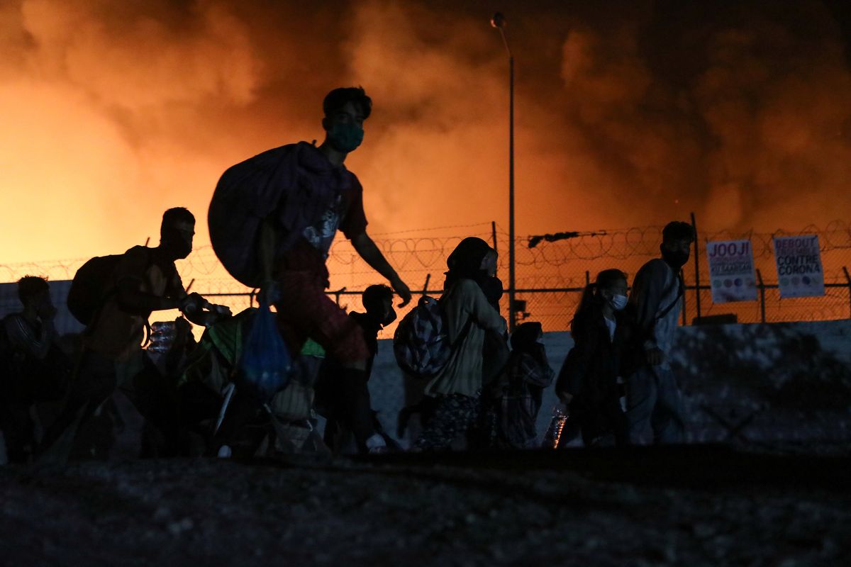 Hard Numbers: Greek refugee camp in flames, SA economy in freefall, US to cut troops in Iraq, COVID vaccine trial on pause