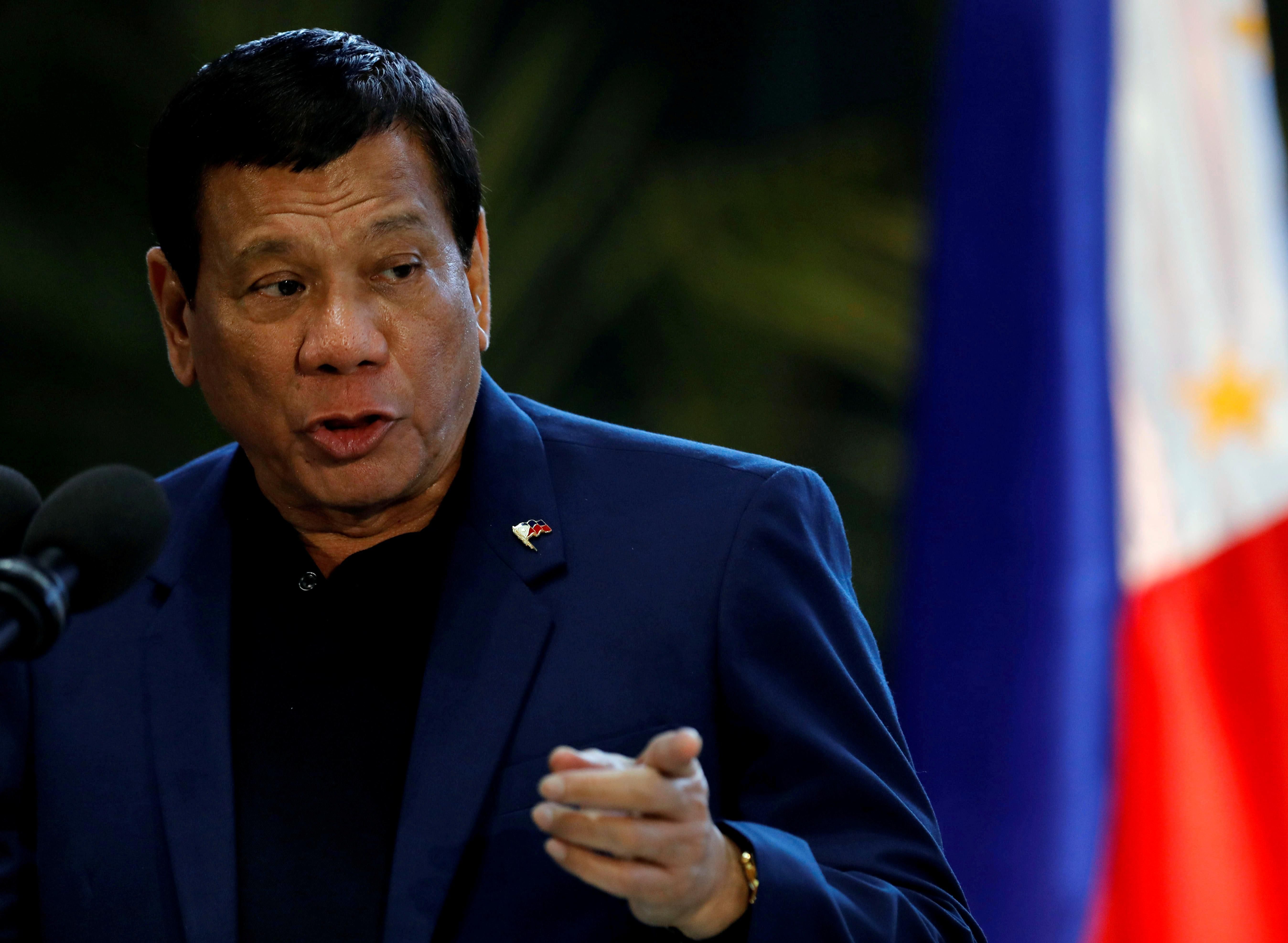 Philippine President Rodrigo Duterte speaks during a news conference at the Ninoy Aquino International Airport in Paranaque, Metro Manila, Philippines