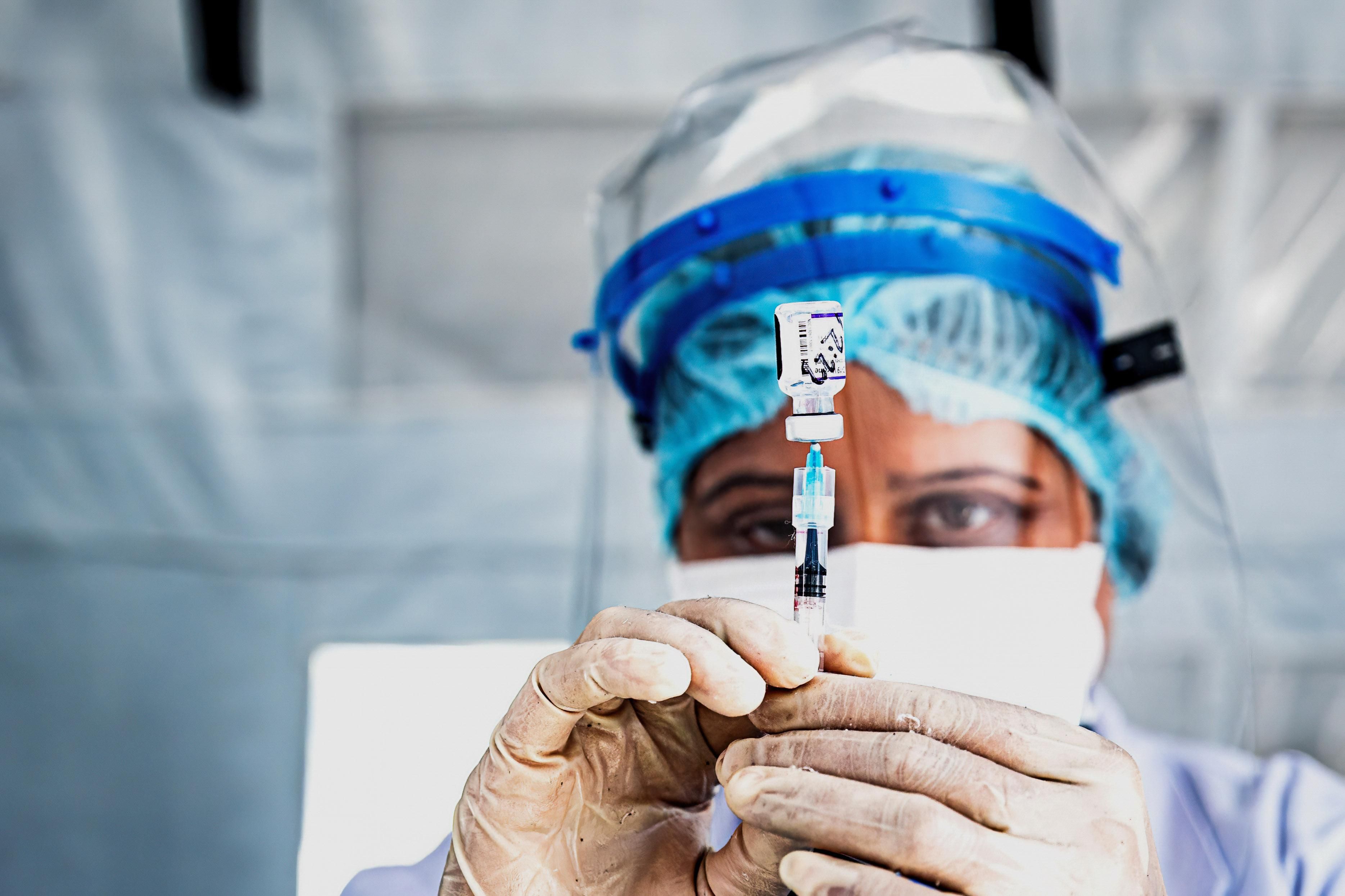 A health worker prepares the Pfizer-BioNTech vaccine at the Civil hospital. Nepal government has started inoculating the children aged above 17 years and chronically ill people by Pfizer vaccine which was provided by the US government to Nepal through COVAX facility.