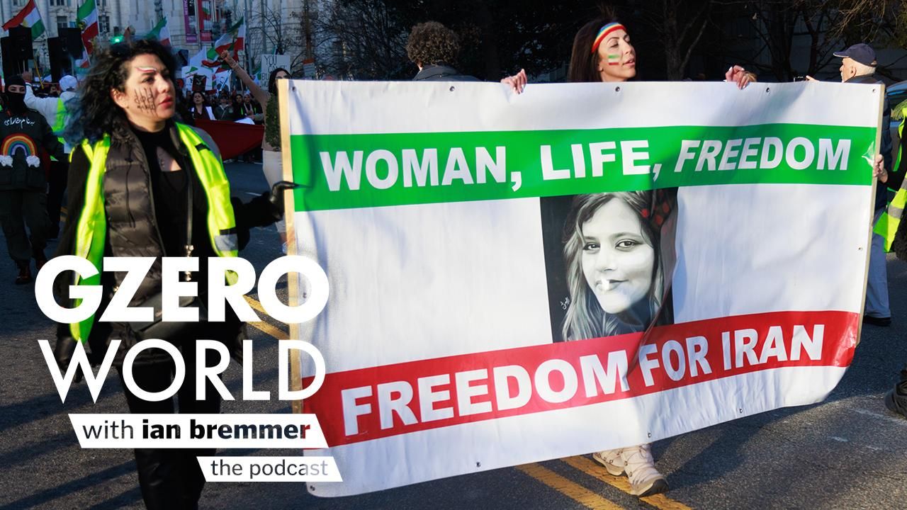 Women at a protest carrying a banner that reads "Woman, Life, Freedom for Iran" | GZERO World with Ian Bremmer - the podcast