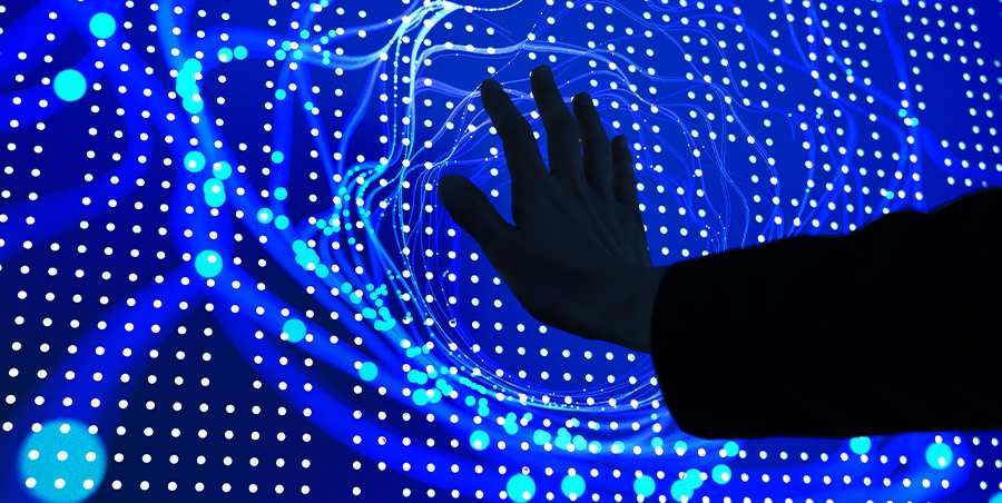 Palm touching a screen with dots on a blue background imitating AI
