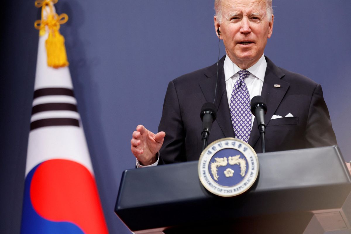 In Asia to fix imbalance, Biden talks both guns and butter