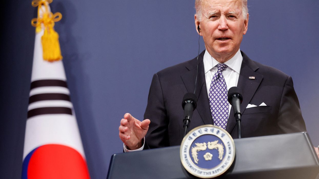 In Asia to fix imbalance, Biden talks both guns and butter