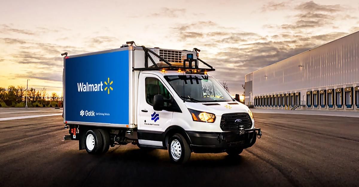 In the foreground a Walmart delivery truck parked in an empty parking lot with a horizon depicted in the background