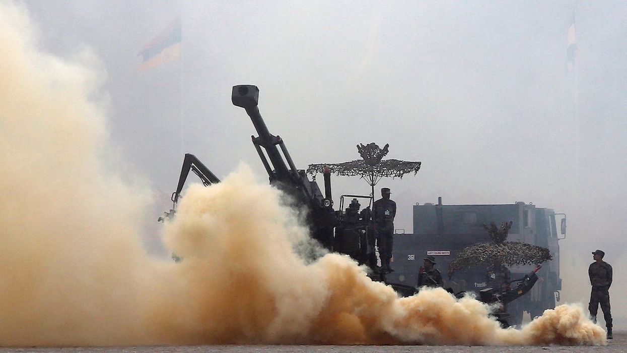 Indian Army soldiers participate in a mock drill exercise during the Army Day parade in New Delhi, India, January 15, 2016. India celebrated the 68th anniversary of the formation of its national army with soldiers from various regiments, and artillery on display on Friday.