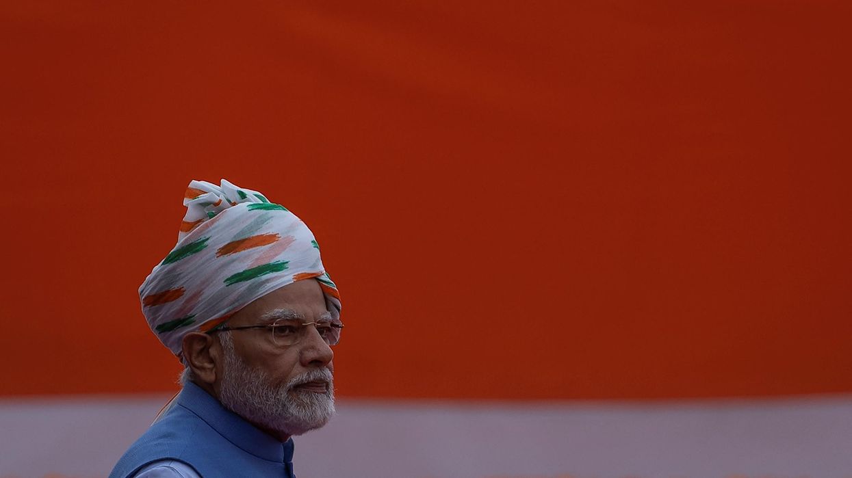 Indian PM Narendra Modi walks after inspecting the honor guard during Independence Day celebrations at the historic Red Fort in Delhi.