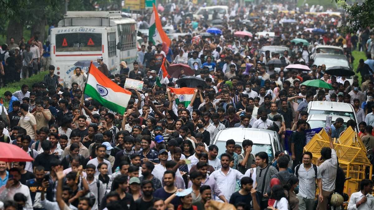 Indians storming the streets of New Delhi demanding the resignation of Education Minister Dharmendra Pradhan