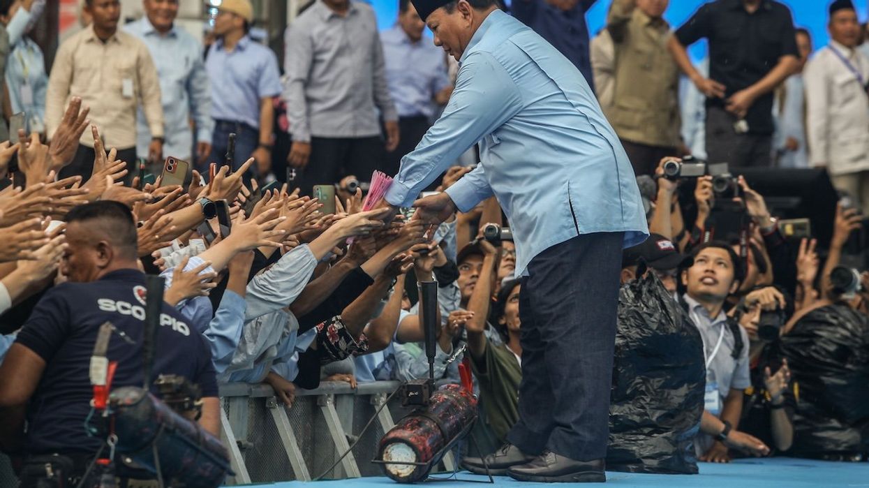 Indonesia's Defence Minister and presidential candidate Prabowo Subianto is gesturing to his supporters during an election campaign rally at the Gelora Delta Stadium in Sidoarjo, East Java, Indonesia, on Feb. 9, 2024.