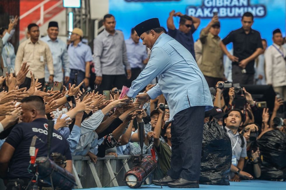Indonesia's Defence Minister and presidential candidate Prabowo Subianto is gesturing to his supporters during an election campaign rally at the Gelora Delta Stadium in Sidoarjo, East Java, Indonesia, on Feb. 9, 2024.