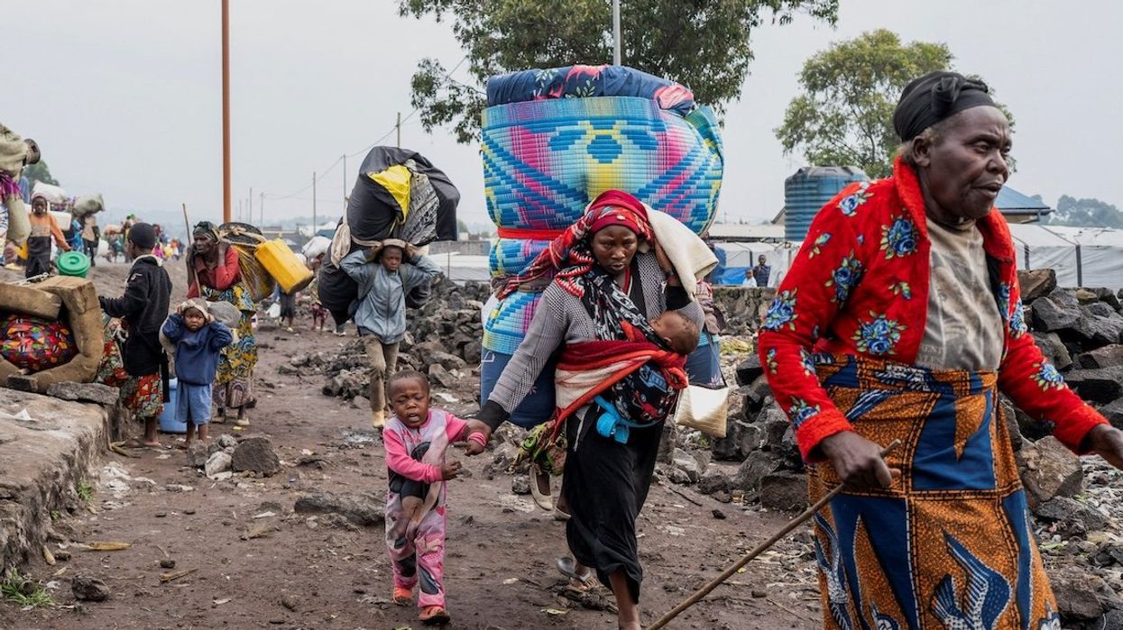 Internally displaced civilians from the camps in Munigi and Kibati carry their belongings as they flee following the fight between M23 rebels and the Armed Forces of the Democratic Republic of the Congo, in Goma, Democratic Republic of Congo, on Jan. 26, 2025.