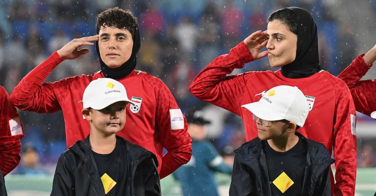​Iran player Fatemeh Pasandideh (right) reacts during the national anthem of Iran prior to the AFC Women’s Asian Cup Group A match between Iran and Philippines at Gold Coast Stadium on the Gold Coast, Sunday, March 8, 2026. 