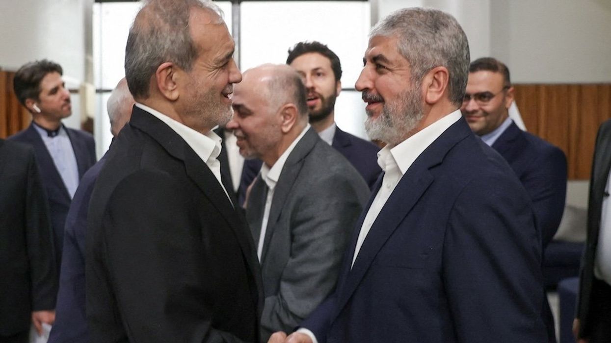 Iran's President Masoud Pezeshkian meets with Hamas leader Khaled Mashal, in Doha, Qatar, on Oct. 2, 2024.