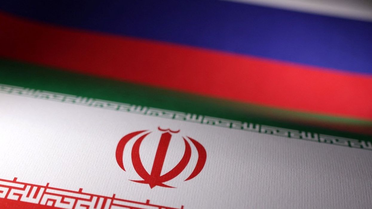 Iranian and Russian flags are seen in this illustration.