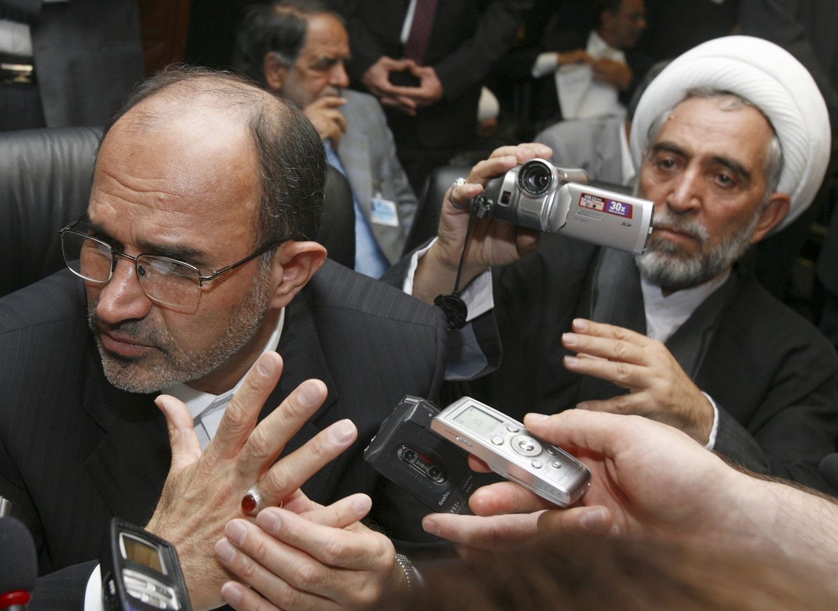 Iranian oil minister Gholamhossein Nozari talks to journalists