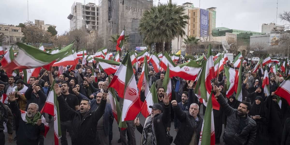 ​Iranian pro-government protesters wave national flags while participating in an anti-war protest gathering against the U.S. and Israeli military attacks in Iran, in Tehran, Iran, on February 28, 2026. 