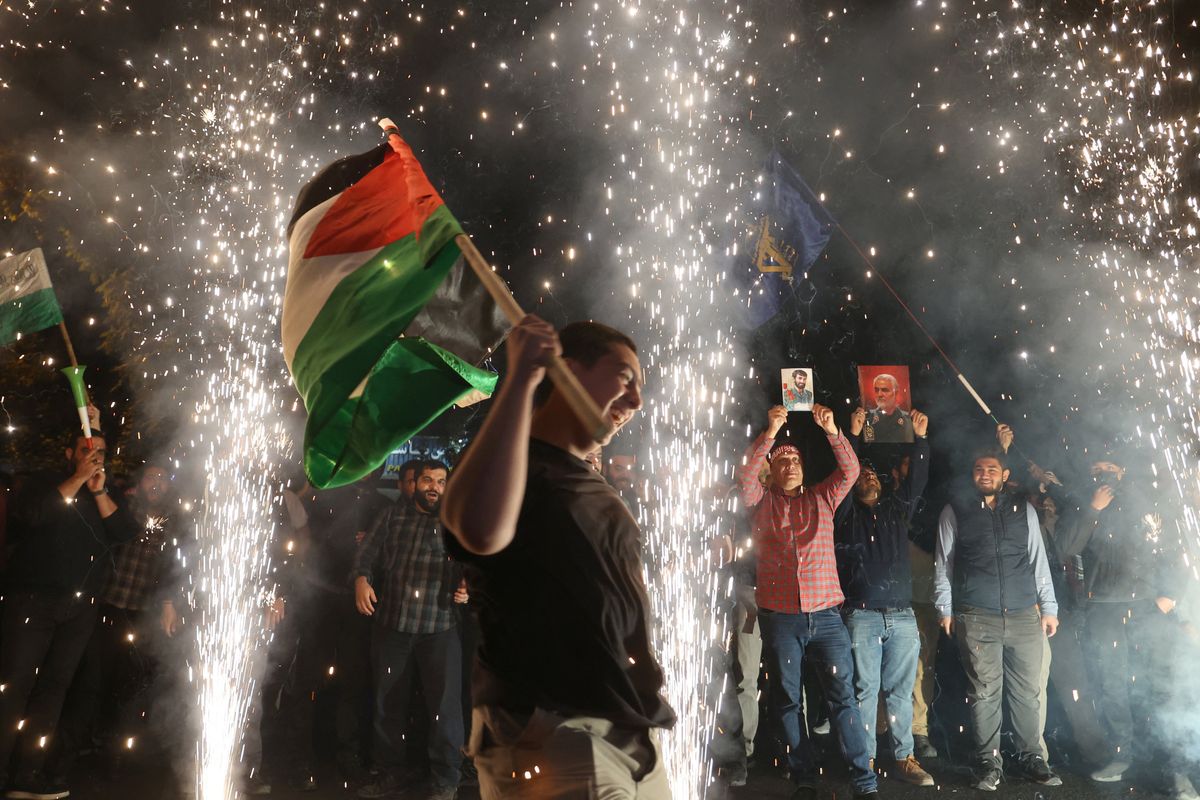 ​Iranians celebrate Hamas's assault on Israel during a gathering in support of Palestinians, in Tehran, Iran, on Oct. 7, 2023.