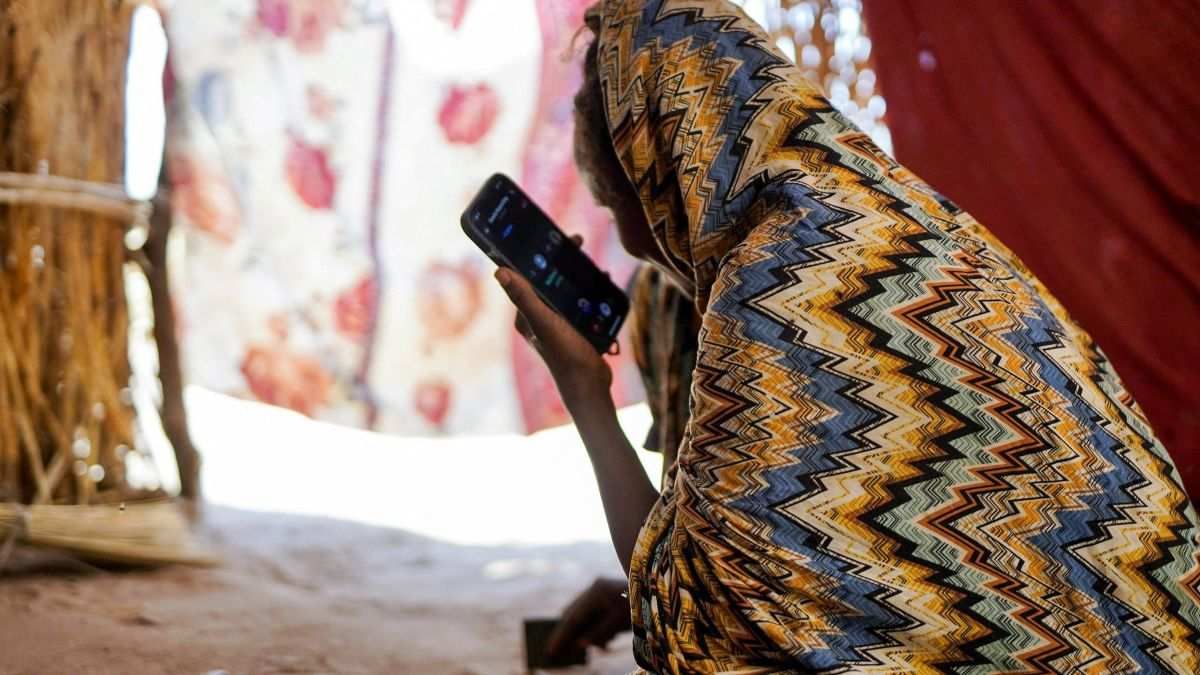 ​Israa Mukhtar, a witness of the RSF attack in April 2025 on a medical clinic, sits inside a tent in Tawila, North Darfur, Sudan, on June 13, 2025.