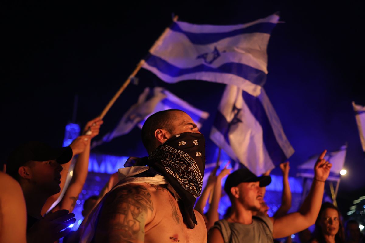Israeli demonstrators take part in a protest against Israeli Prime Minister Benjamin Netanyahu's government.
