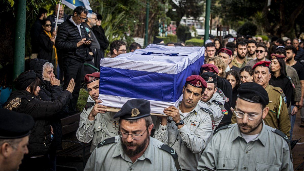 Israeli officers carry the coffin of Major Ilay Levy during his funeral ceremony at the Tel Aviv's military cemetery. Levi, 24, was killed in a battle in the southern Gaza Strip. 