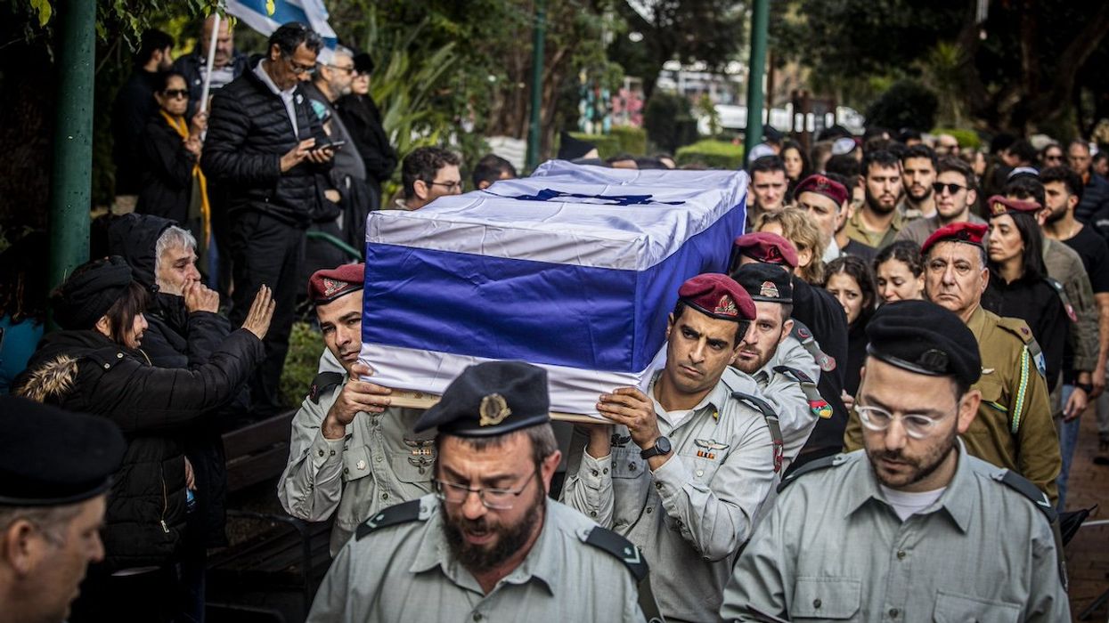 Israeli officers carry the coffin of Major Ilay Levy during his funeral ceremony at the Tel Aviv's military cemetery. Levi, 24, was killed in a battle in the southern Gaza Strip.