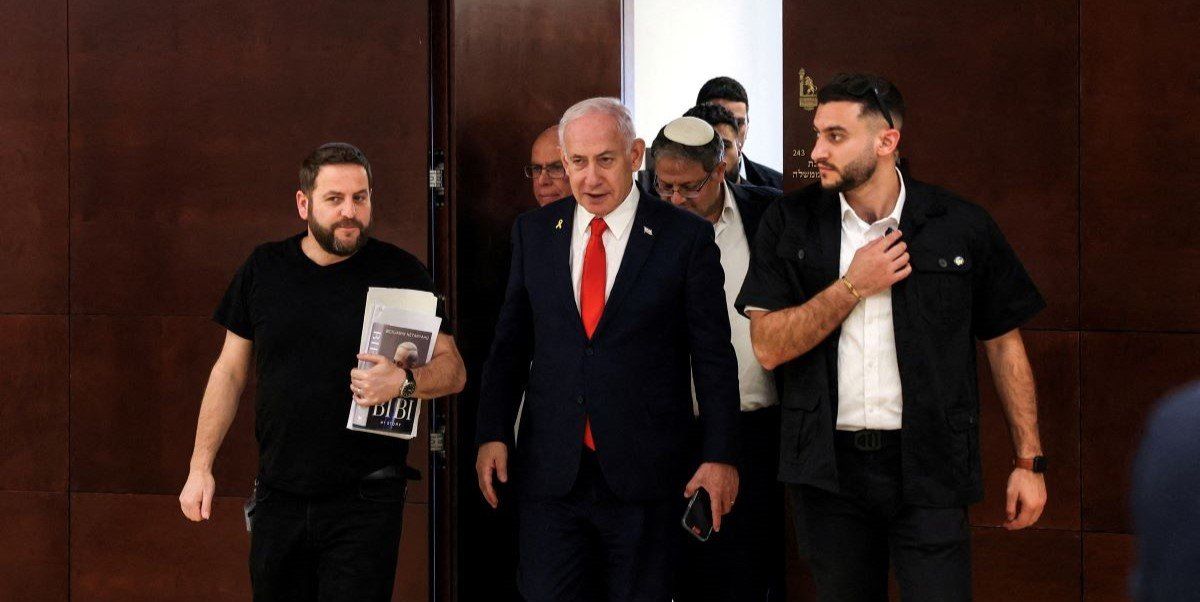Israeli Prime Minister Benjamin Netanyahu followed by National Security Minister Itamar Ben-Gvir walk inside the Israeli parliament, the Knesset, in Jerusalem March 27, 2025. 