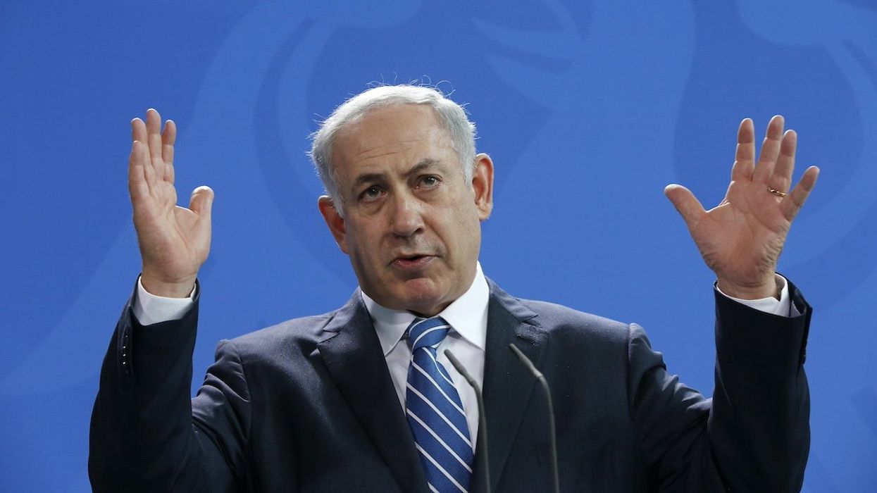 Israeli Prime Minister Benjamin Netanyahu gestures as he addresses a news conference at the Chancellery in Berlin, Germany, February 16, 2016.