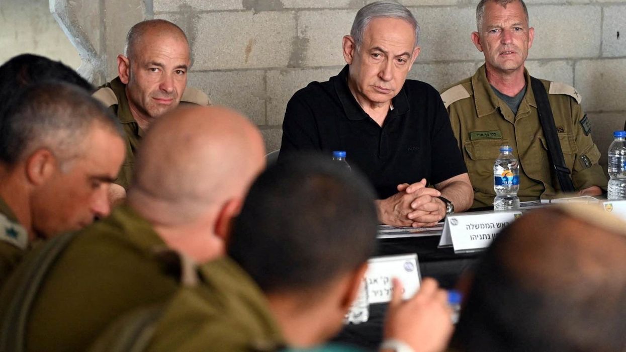 Israeli Prime Minister Benjamin Netanyahu meets with soldiers as he visits an Israeli army base in Tze'elim, Israel November 7, 2023.