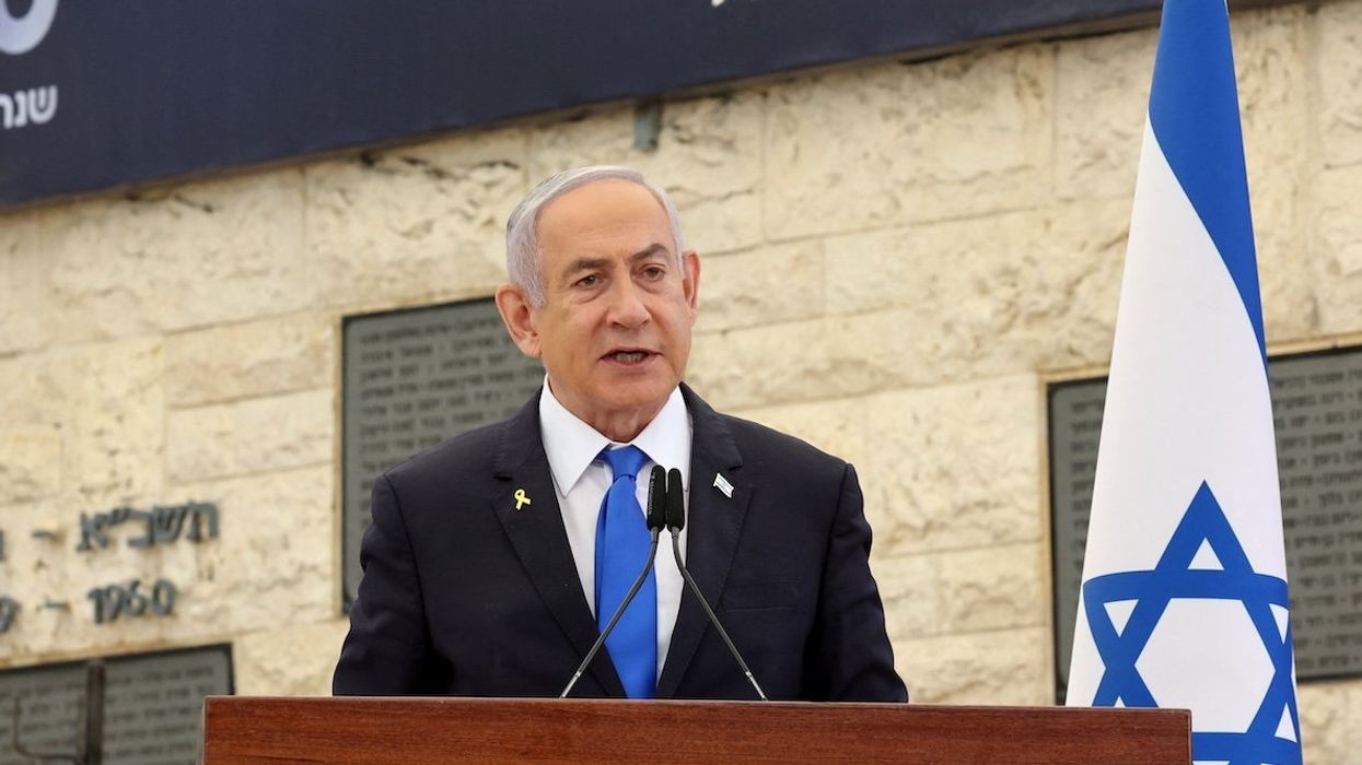 Israeli Prime Minister Benjamin Netanyahu speaks during a memorial ceremony of the Hamas Oct. 7 attack at the Mount Herzl military cemetery in Jerusalem on Oct. 27, 2024, where he was heckled by family members victims.