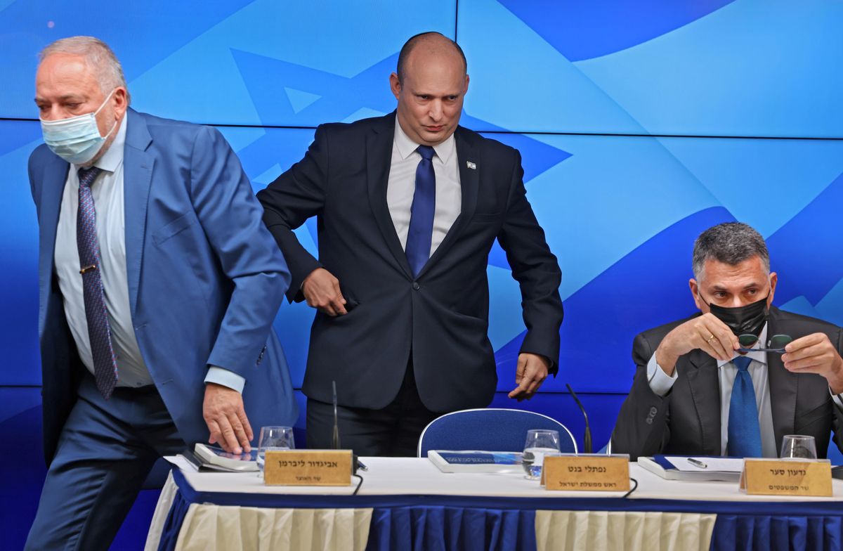  Israeli Prime Minister Naftali Bennett stands between Finance Minister Avigdor Lieberman and Justice Minister Gideon Saar at a news conference on economy in Jerusalem, July 6, 2021