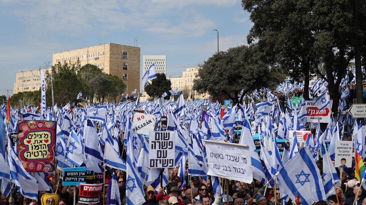 Israeli protesters demonstrate against the right-wing government outside the Knesset in Jerusalem.