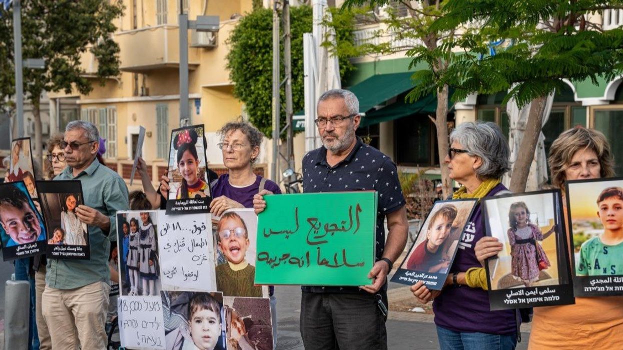 Israelis hold up photos of dead children in Gaza at demonstration in Tel Aviv, May 7th, 2025.