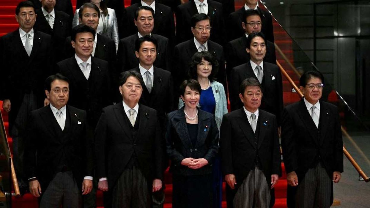 Japan's new Prime Minister Sanae Takaichi (C, first row) poses during a photo session with members of her cabinet at the prime minister's office in Tokyo, Japan October 21, 2025.