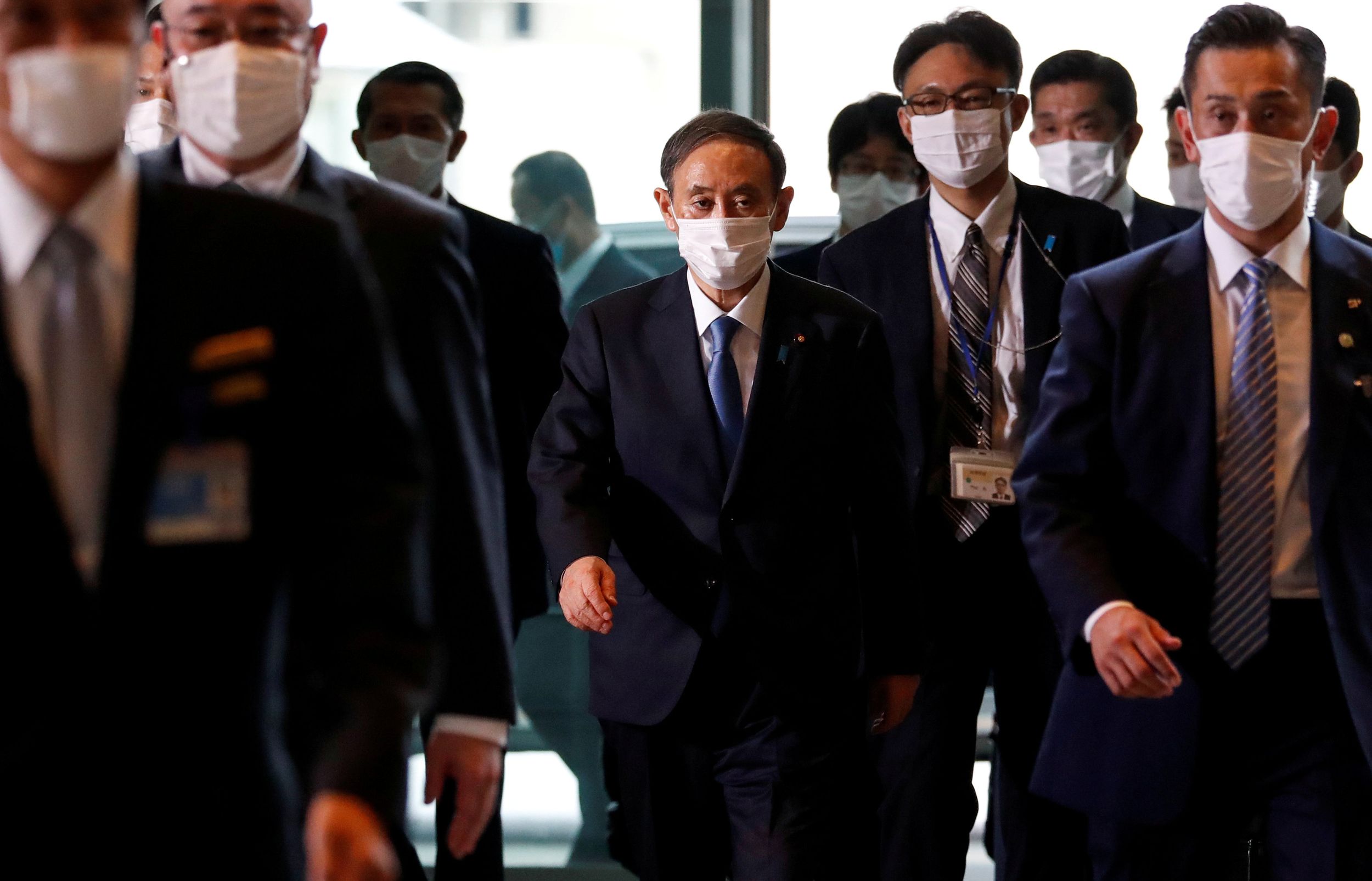 Japan's newly-elected Prime Minister Yoshihide Suga arrives at his official residence in Tokyo
