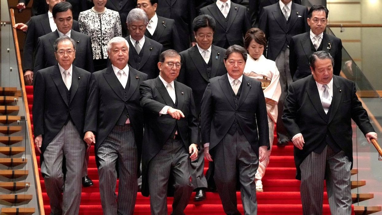 Japan's Prime Minister Shigeru Ishiba arrives for a group photograph with his new cabinet members at the prime minister's official residence in Tokyo, Japan, October 1, 2024.