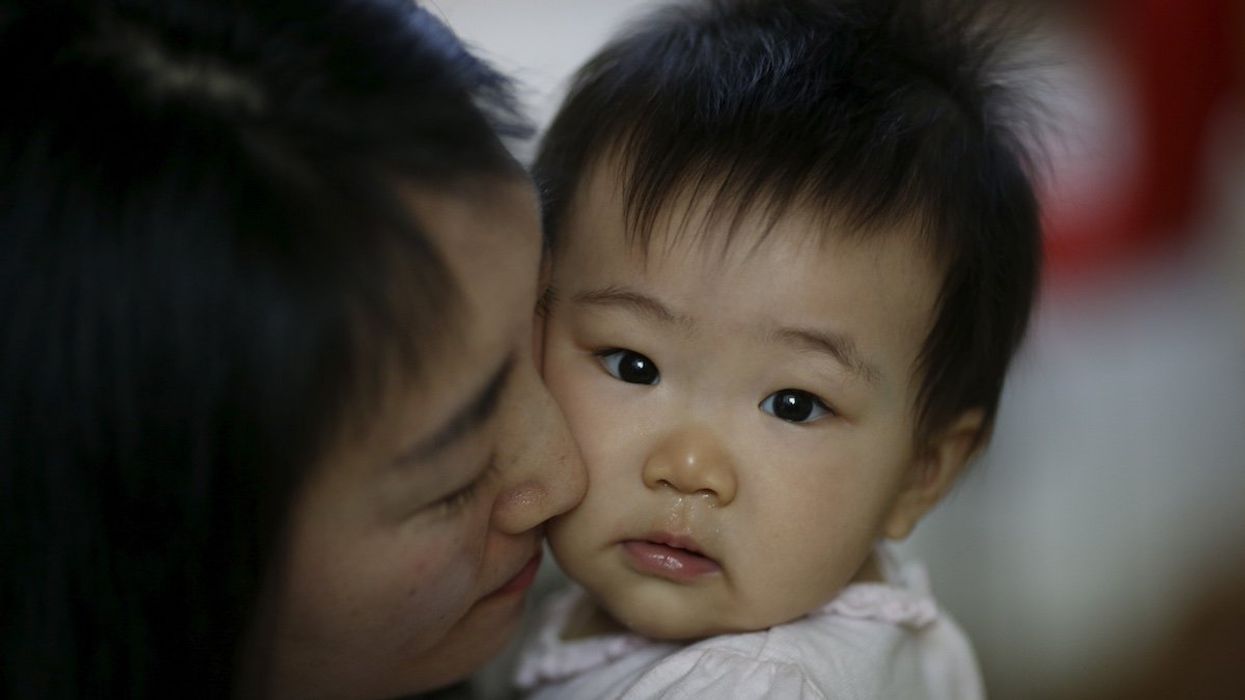 Jeong Bo-mi, 37, and her baby in Seoul, South Korea, April 7, 2016.