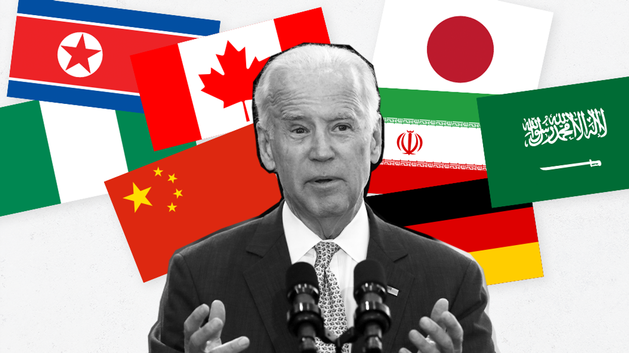 Joe Biden at a speaking lectern surrounded by an array of national flags belonging to Japan, Germany, Iran, China, Nigeria, North Korea, Canada and Saudi Arabia