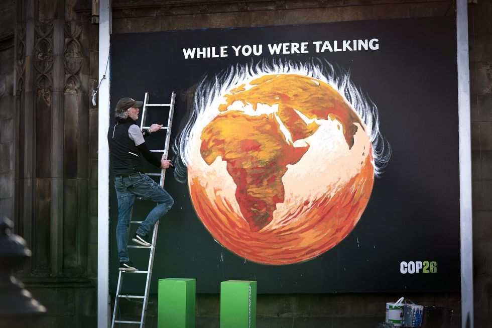 Justice and Peace artist Greg Mitchell completes his climate-crisis themed mural in Edinburgh.