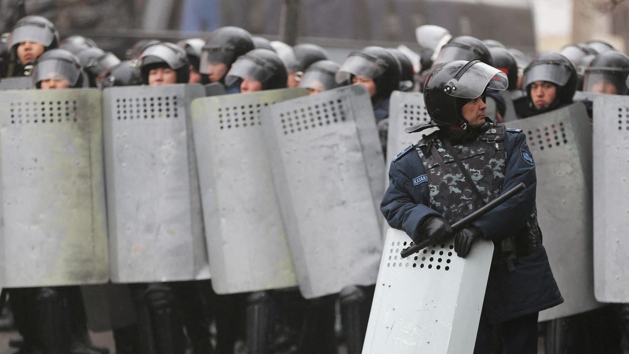 Kazakh law enforcement officers block a street during a protest triggered by fuel price increase in Almaty, Kazakhstan January 5, 2022.