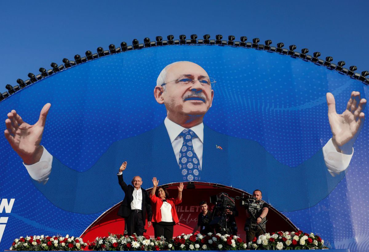 Kemal Kilicdaroglu, leader of Turkey's main opposition Republican People's Party, greets his supporters accompanied by his wife during a rally in Istanbul.